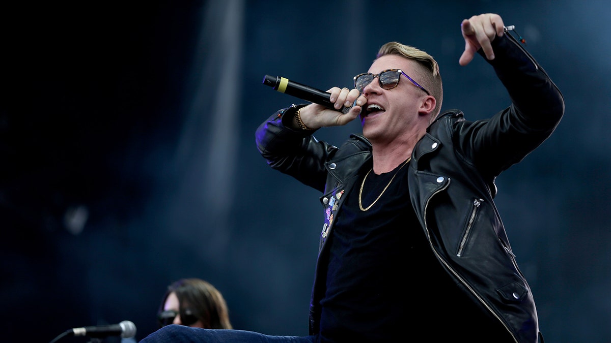 Macklemore performs on stage