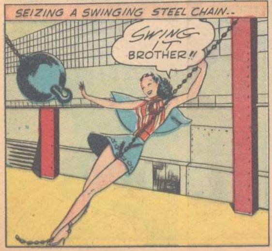 Miss America swings from a chain to intercept a steel ball.