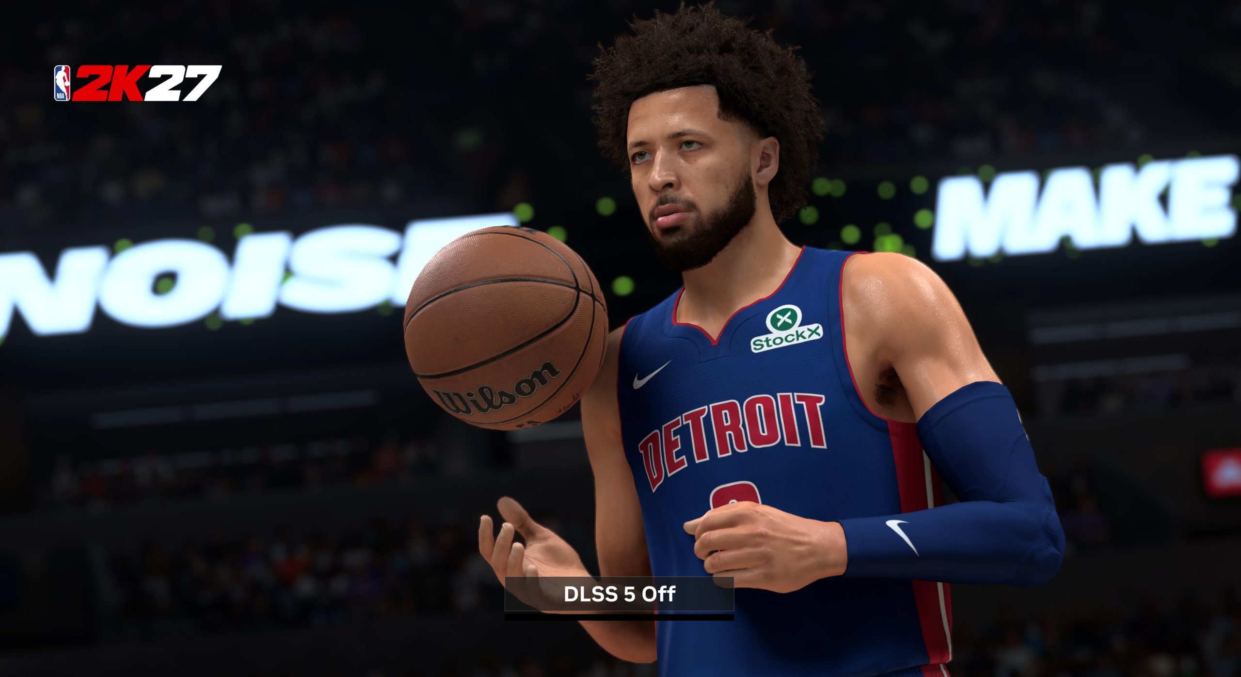 A basketball player in a 'Detroit' jersey is holding a Wilson basketball in the game NBA 2K27, with the on-screen text reading 'DLSS 5 Off'.
