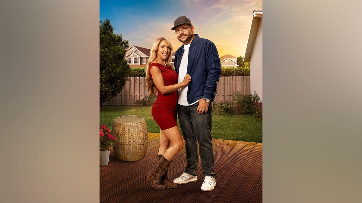 Tammy and Drew pose for a photo together for