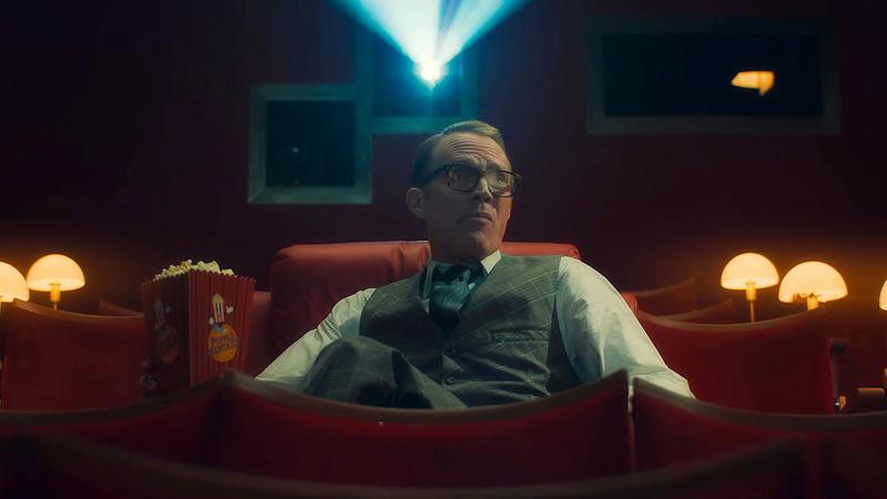 Vision watching his memories on a cinema screen.