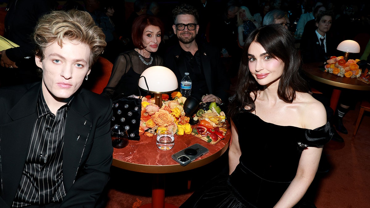 Aimee Osbourne sits with Sharon Osbourne and Jack Osbourne.