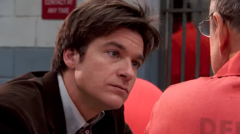 Jason Bateman as Michael Bluth talks to a prison inmate on Arrested Development