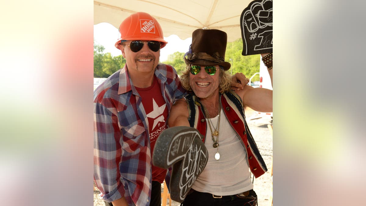 John Rich and Big Kenny stand backstage at an ESPN GameDay taping.