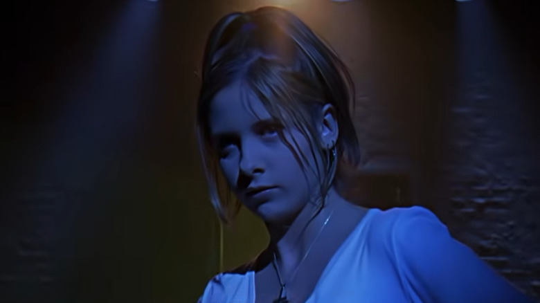 Buffy Summers stands in the dark