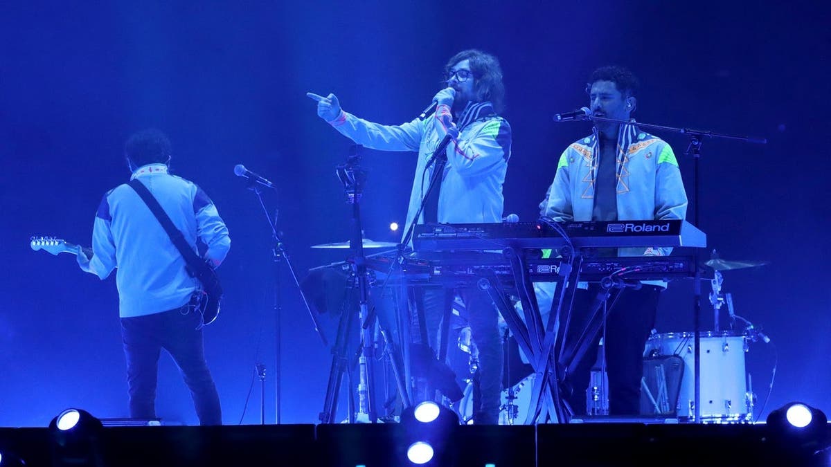 Erick Vázquez, Manuel Mendoza and Jonathan Meléndez perform onstage during a concert.