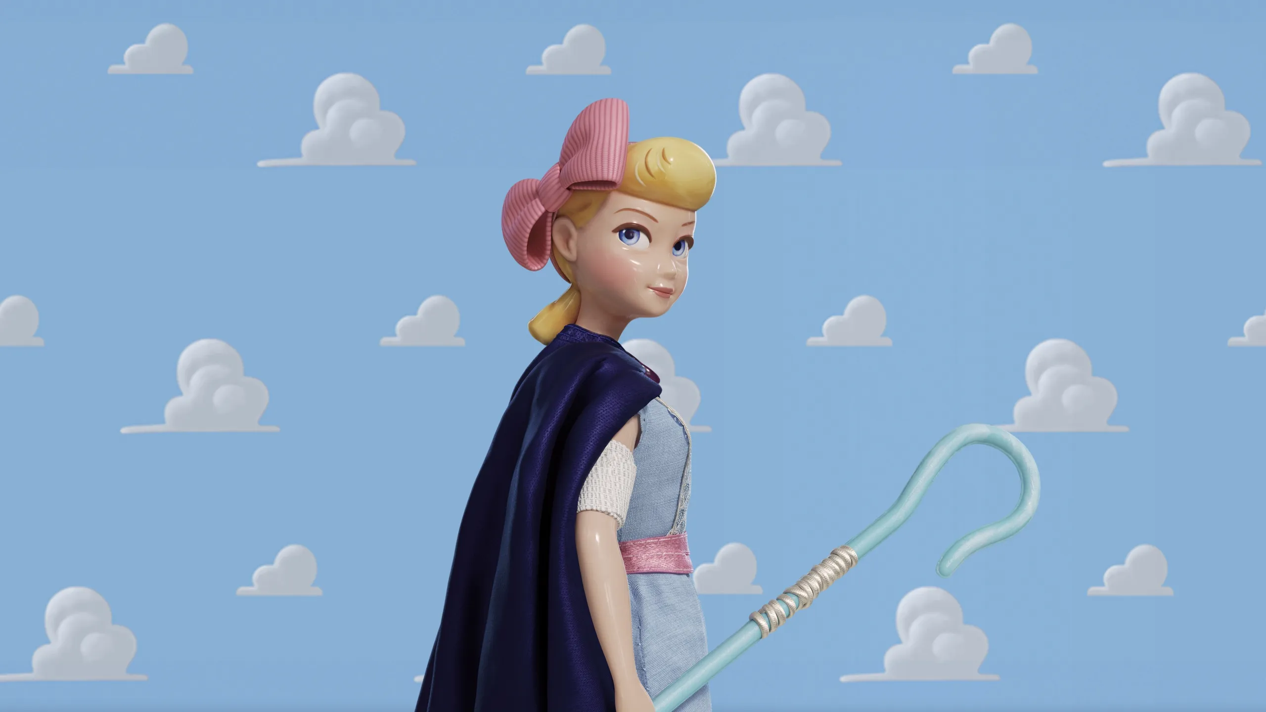Bo Peep wearing a cape and carrying her crook