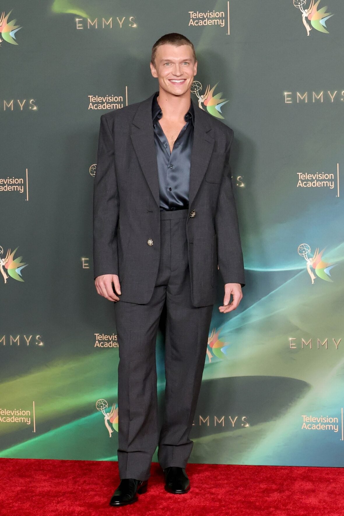 Connor Storrie poses on the red carpet at the Creative Arts Emmy Awards night two