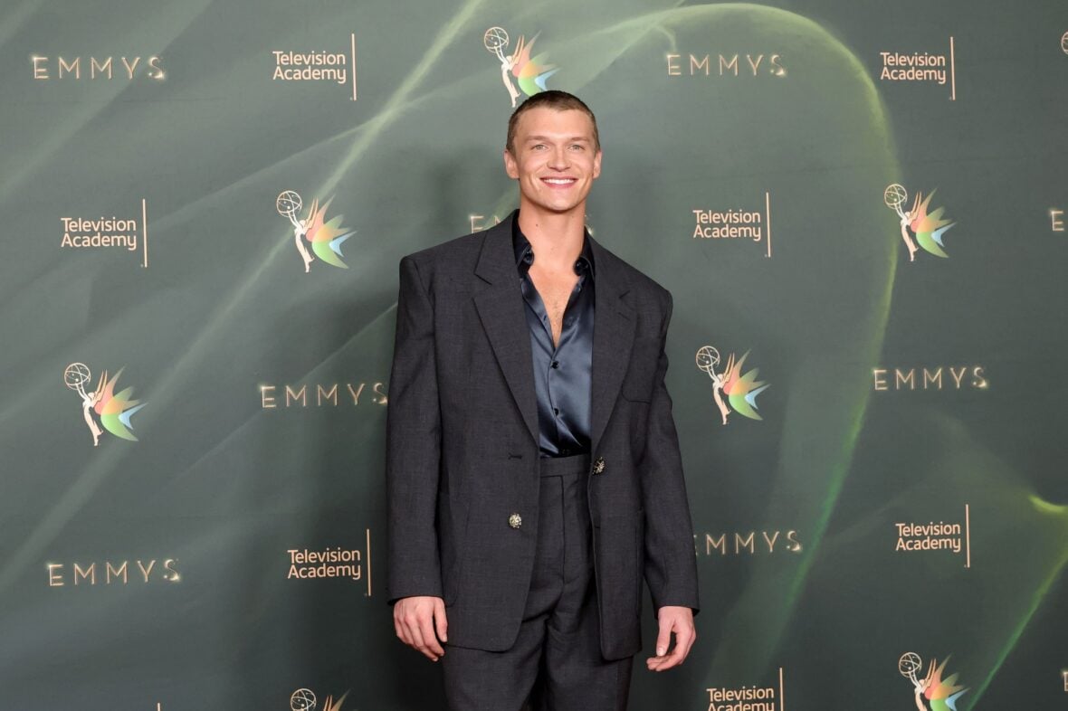 Connor Storrie poses on the red carpet at the Creative Arts Emmy Awards night two