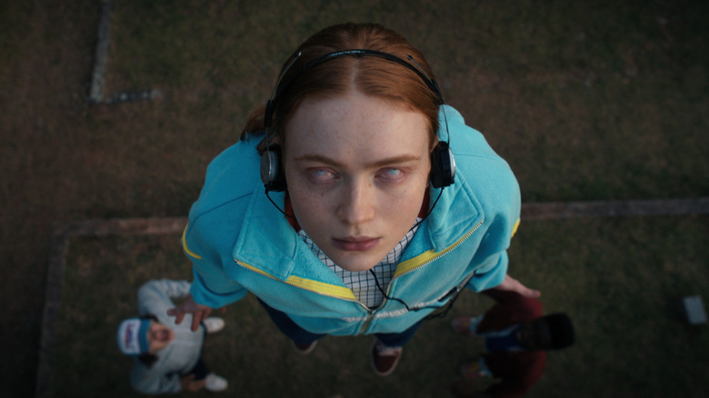 Sadie Sink as Max, levitating with white eyes in Stranger Things.