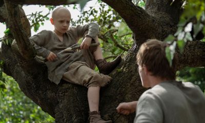 Dexter Sol Ansell as Egg sits on a tree while Peter Claffey as Duncan faces him