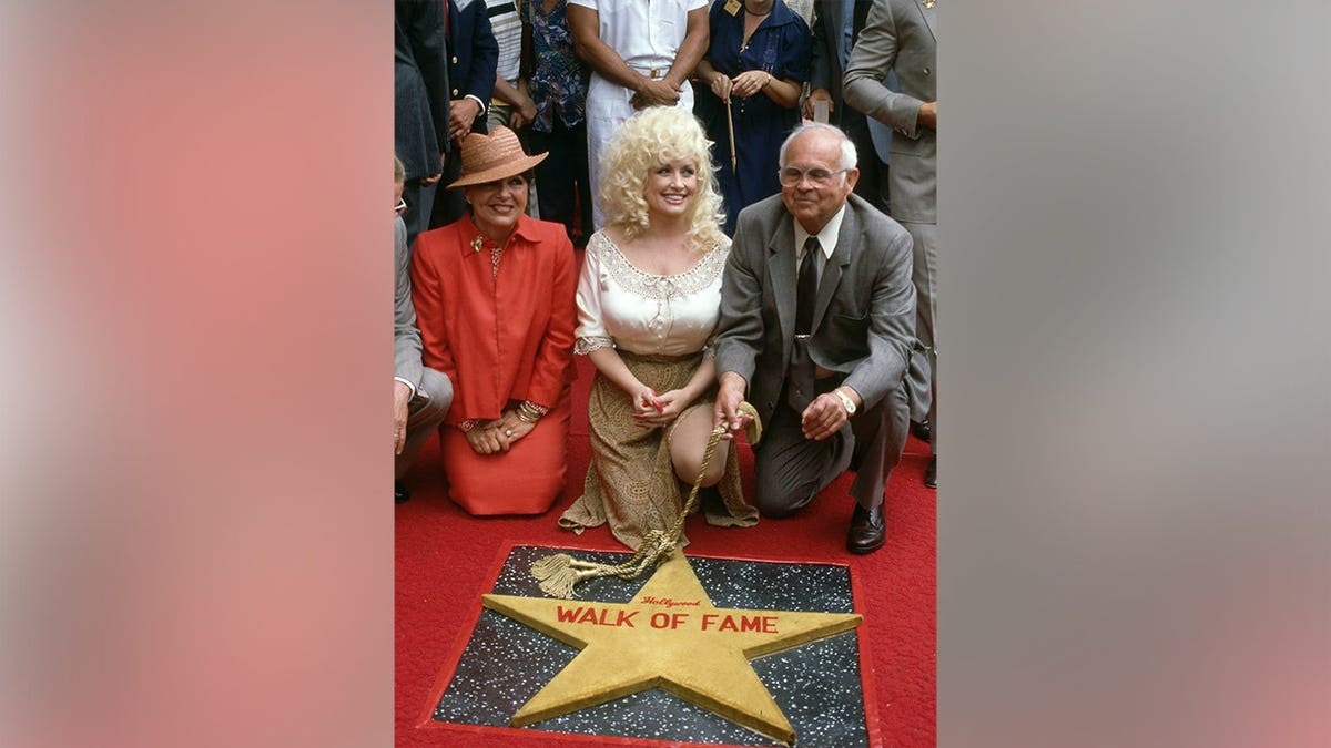 Dolly Parton on the Hollywood Walk of Fame in June 1984.