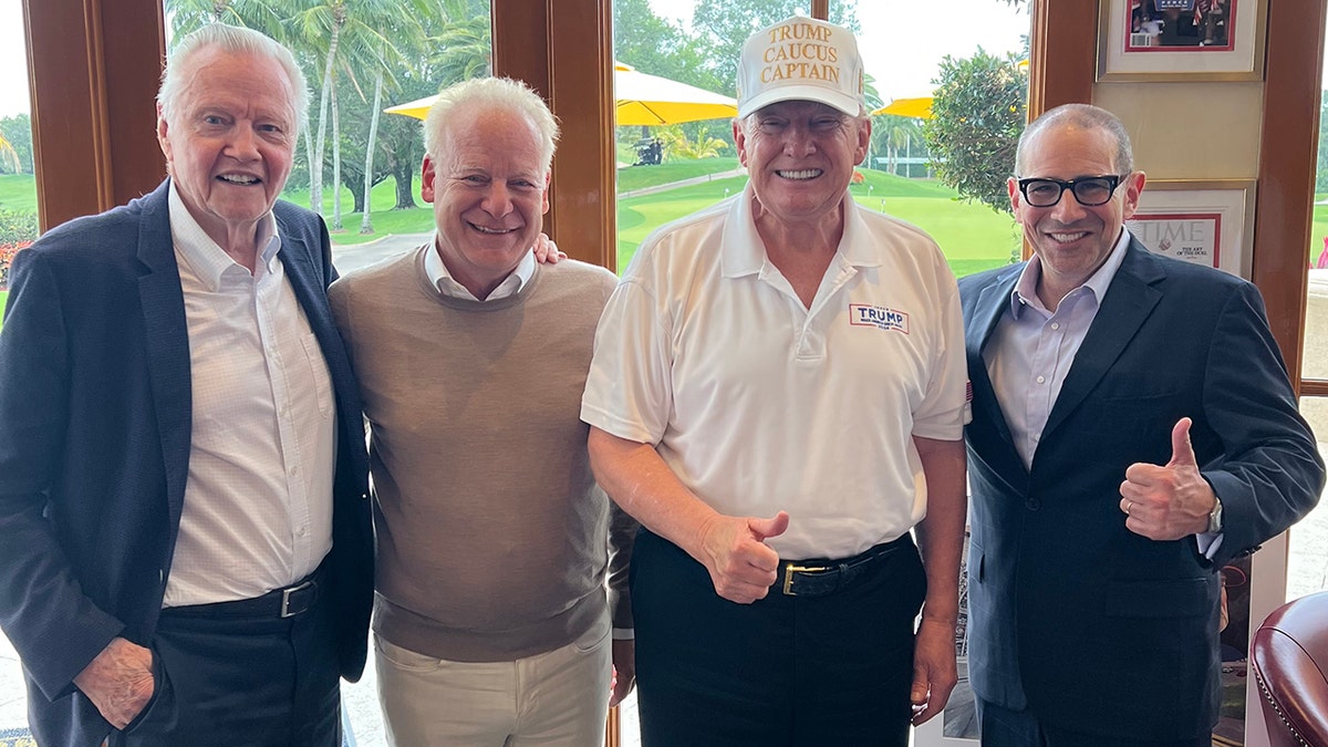 Actor Jon Voight wears blue suit with President Donald Trump