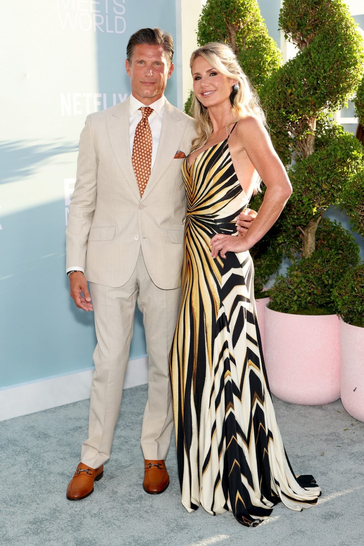 Todd Galski and Alisa Earle pose while attending the premiere of Earle Meets World