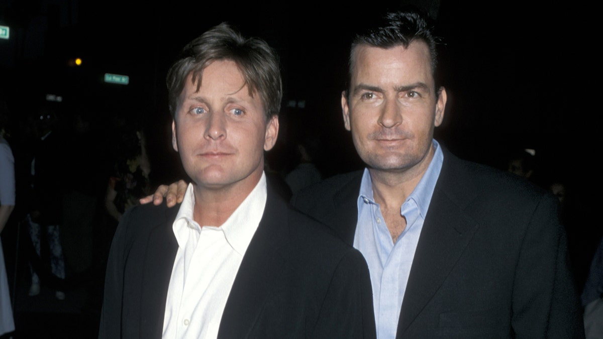 Emilio Estevez and Charlie Sheen at a premiere