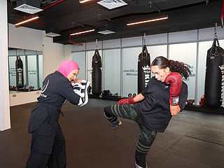 Lara Fawzy, founder and owner of Dubai's Muay Thai gym, with Dania SaifEldawla.