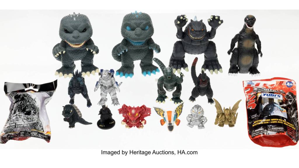 A collection of 14 vintage Godzilla figures and two sealed mystery packs.