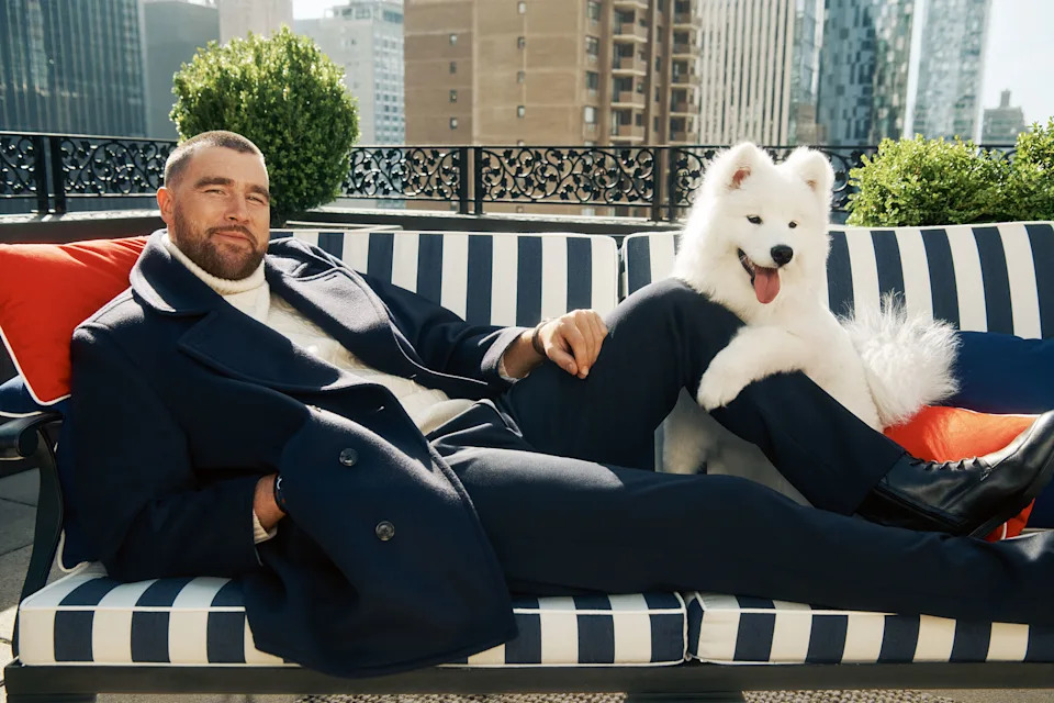 man on couch with dog