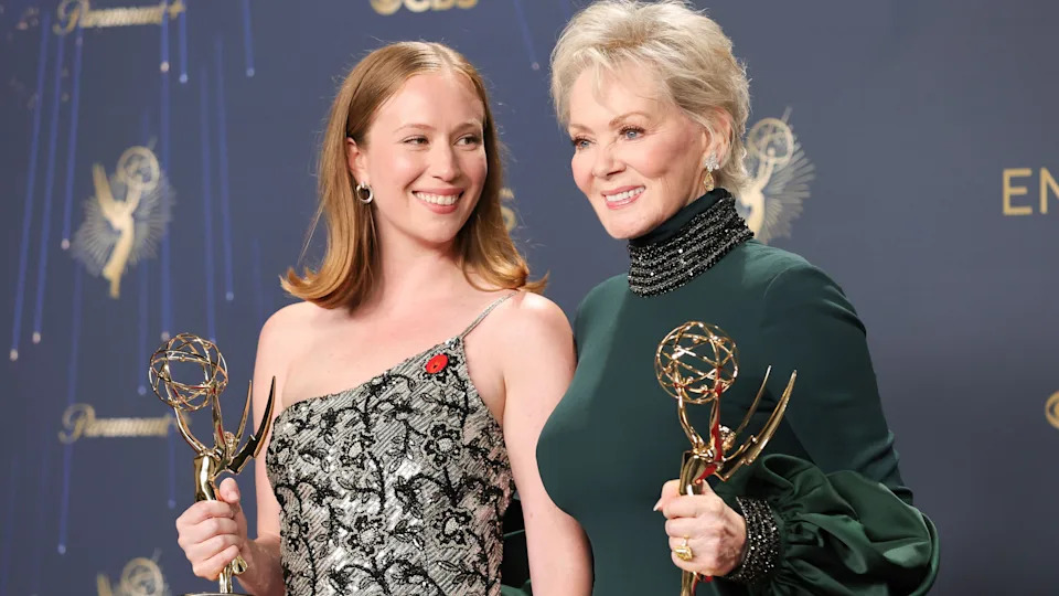 Hannah Einbinder and Jean Smart, winners of outstanding supporting actress in a comedy Series and lead actress in a comedy series for Hacks at last year's Emmys - Einbinder is wearing an off-the-shoulder silver and black dress, while Smart is wearing a forest green high-necked dress