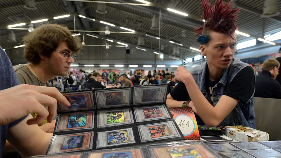 Participants of the German Yu-Gi-Oh! Trading Card Game Championships exchange strategy cards in Schkeuditz, Germany, 18 May 2013.