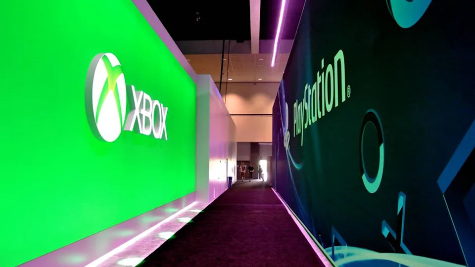 Lit advertising wall show the logos of the 'Xbox' and 'Playstation' game consoles at the E3 games fair in Los Angeles; USA, 11 June 2013.