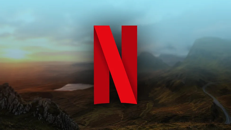 Netflix N logo over a misty mountain valley.