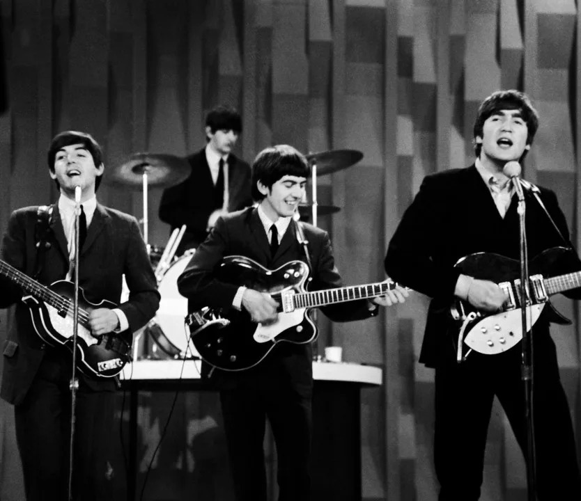 FILE - The Beatles, from left, Paul McCartney, Ringo Starr, George Harrison and John Lennon, perform for the CBS "Ed Sullivan Show" in New York, as they record a set on Feb. 9, 1964, that would be shown later on a broadcast of the show. (AP Photo/Dan Grossi, File)