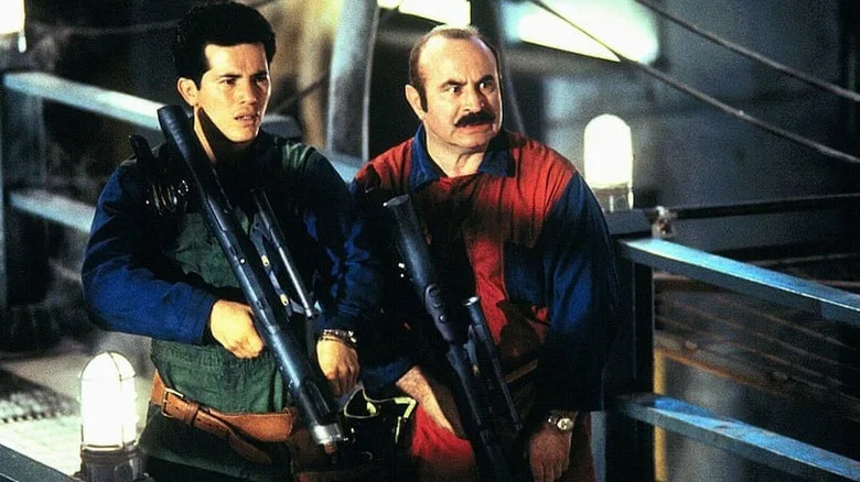 John Leguizamo and Bob Hoskins with prop guns