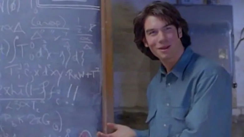 Quinn Mallory by a chalkboard in "Sliders"