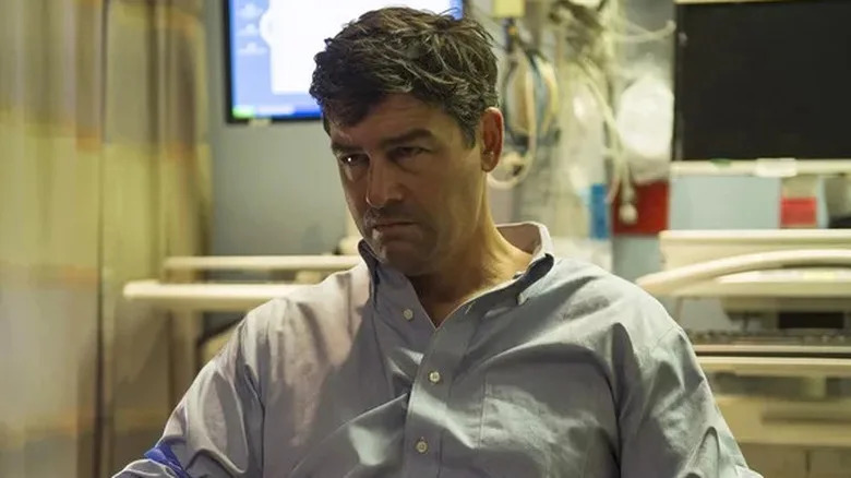 John Rayburn looking intense and wearing a scruffy shirt on Bloodline