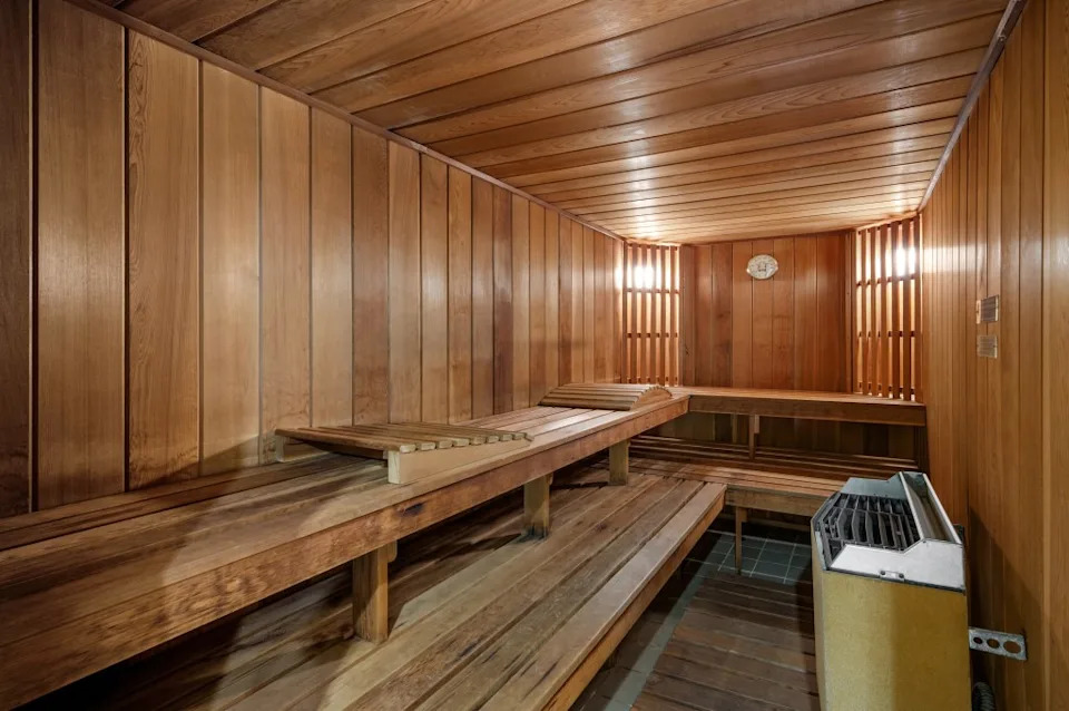 The home features an oak-paneled elevator and a wellness floor with a cold plunge pool and sauna. Carli Biryla