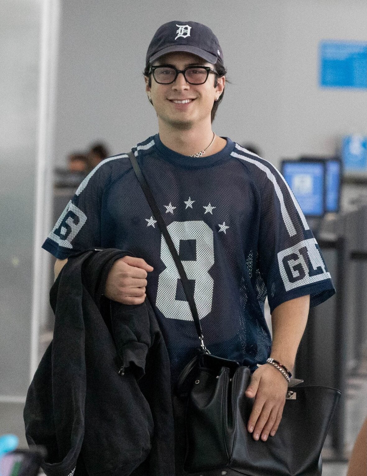 Hudson Williams and Katelyn Larson walking together in Toronto Airport
