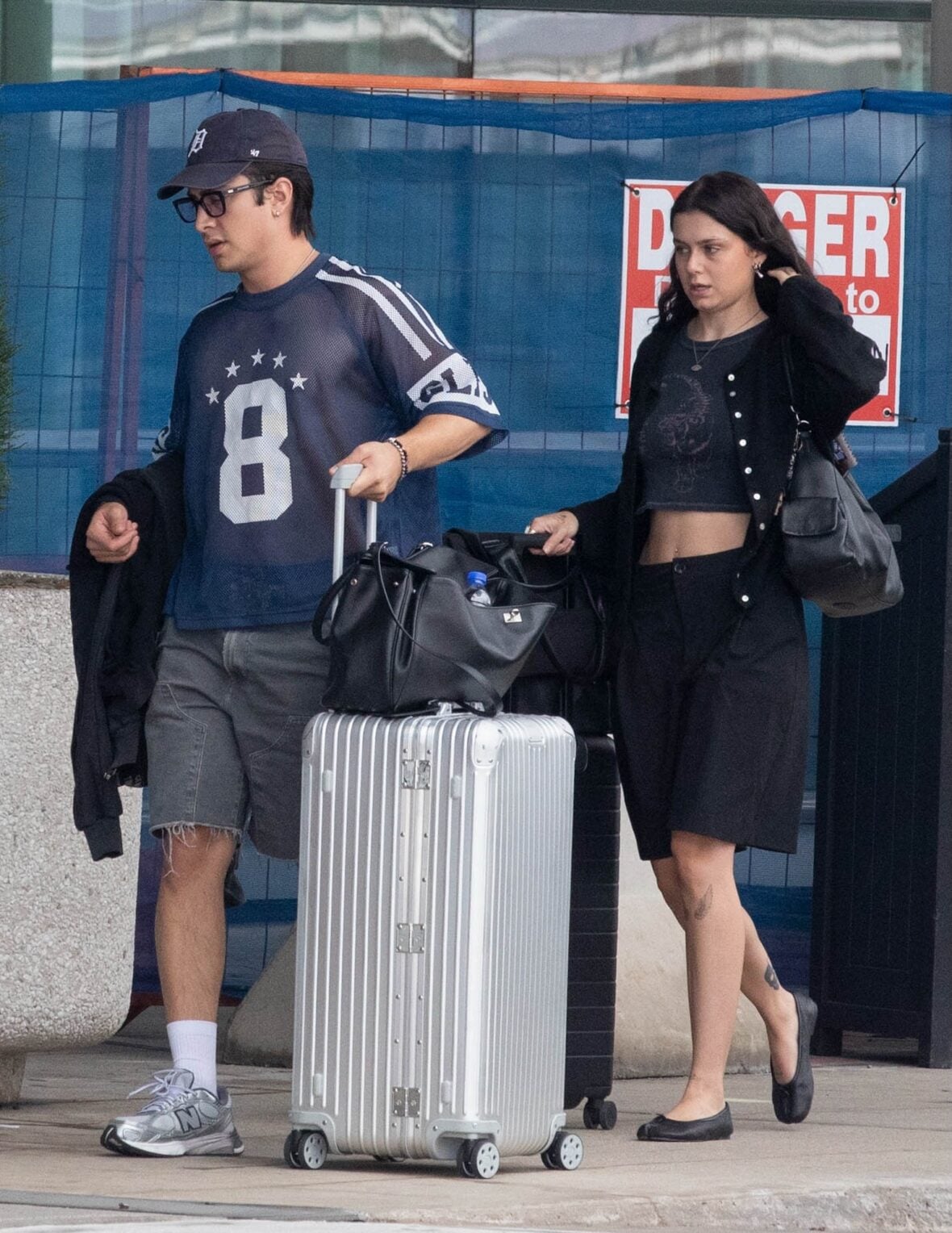 Hudson Williams and Katelyn Larson walking together in Toronto Airport