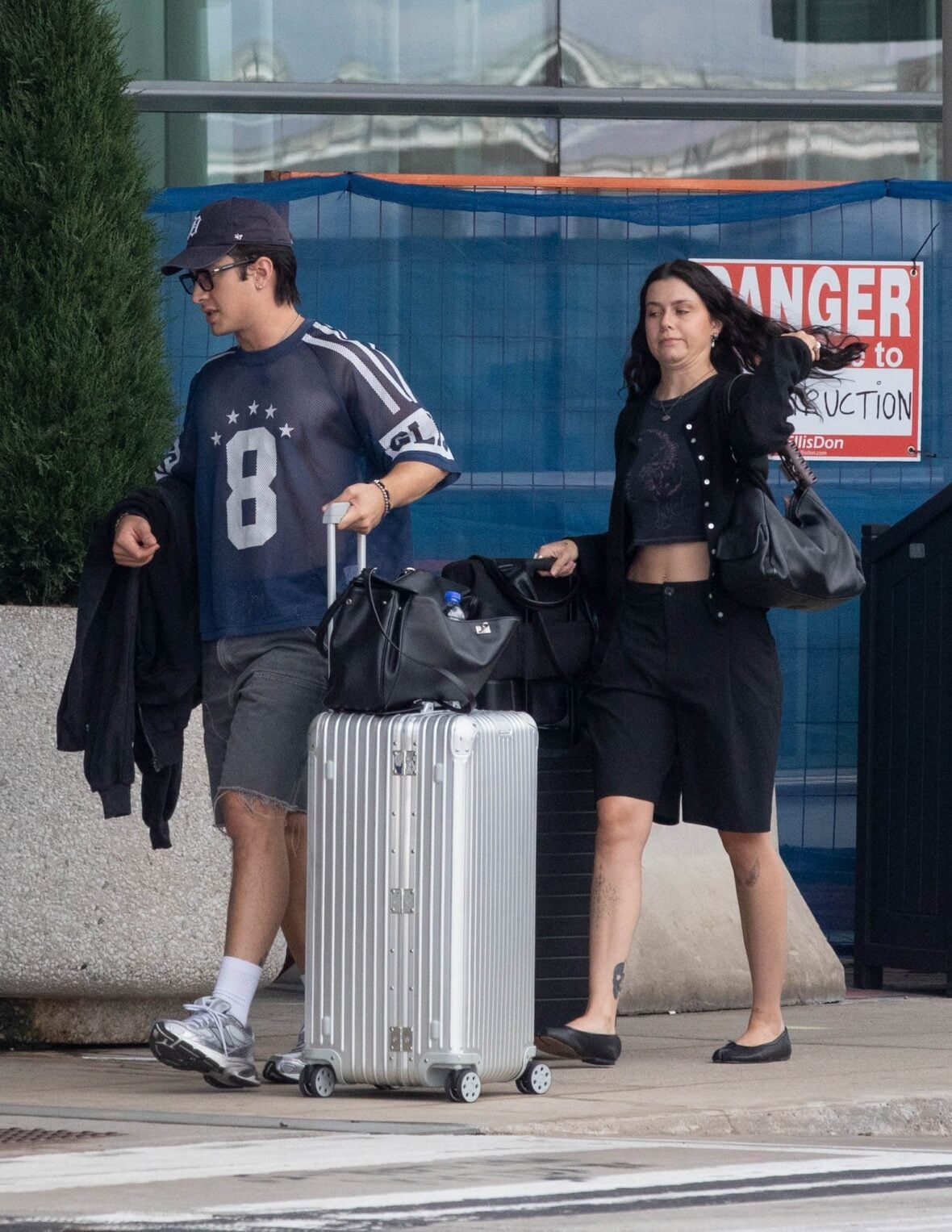 Hudson Williams and Katelyn Larson walking together in Toronto Airport