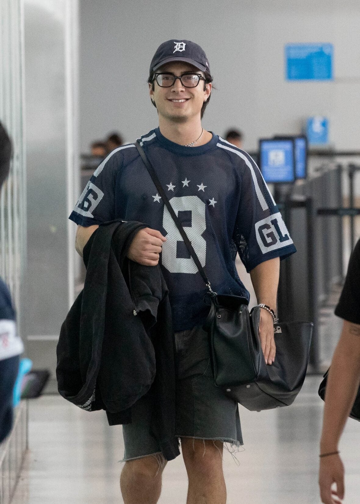 Hudson Williams and Katelyn Larson walking together in Toronto Airport