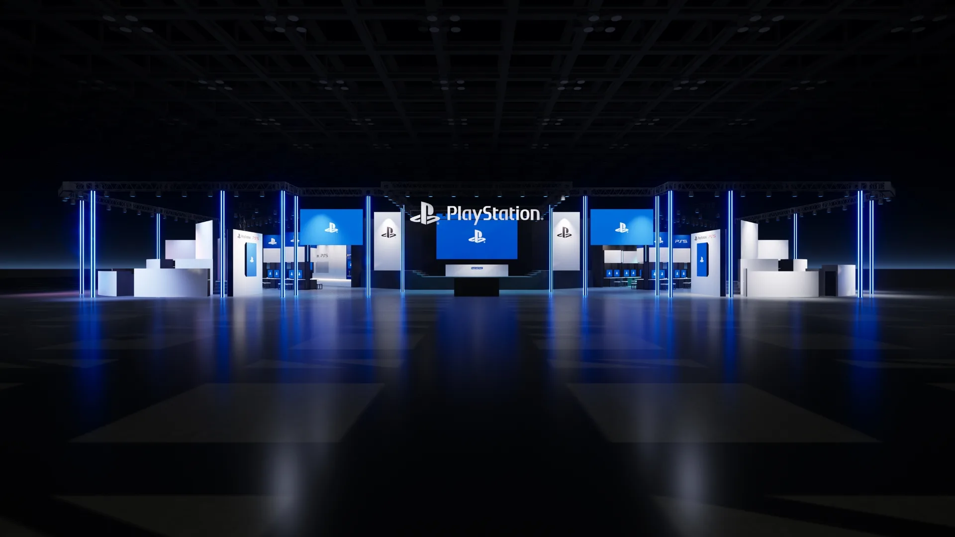 A darkened PlayStation booth at Tokyo Game Show 2025, with blue-lit display towers and screens showing the PlayStation logo.
