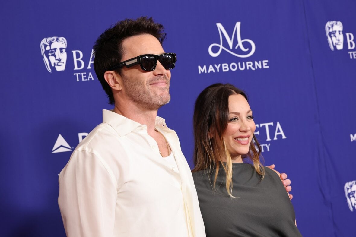 Kaley Cuoco and Tom Pelphrey pose on the red carpet at the BAFTA TV Tea Party
