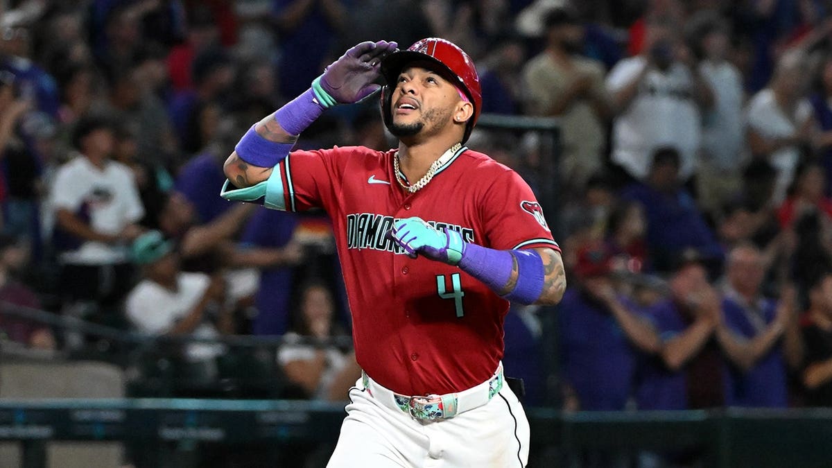 Ketel Marte of the Arizona Diamondbacks celebrating after hitting a home run at Chase Field