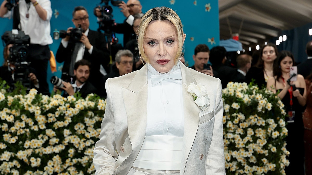 Madonna in a cream suit