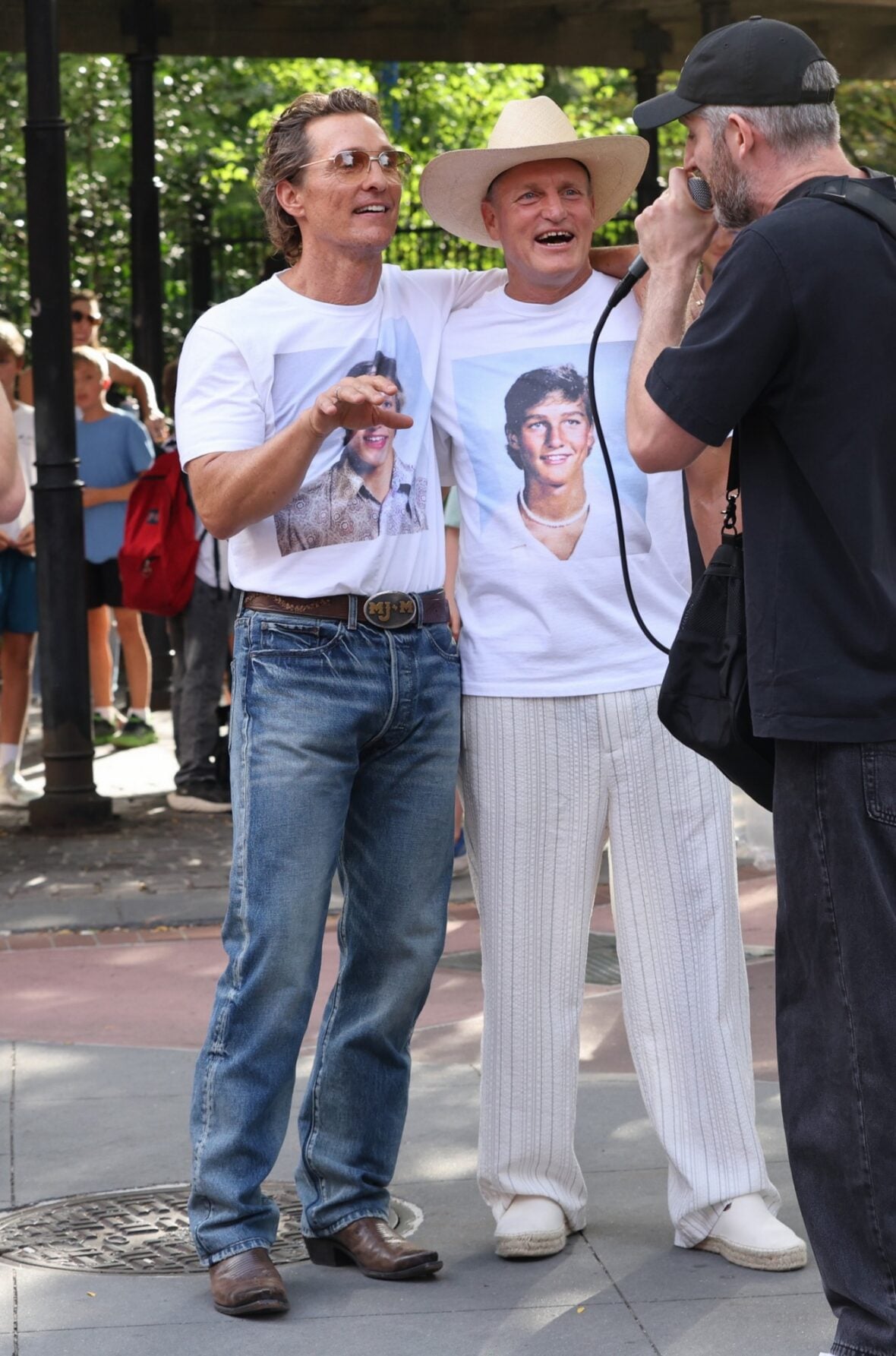 Woody Harrelson and Matthew McConaughey wear shirts with their younger selves on them