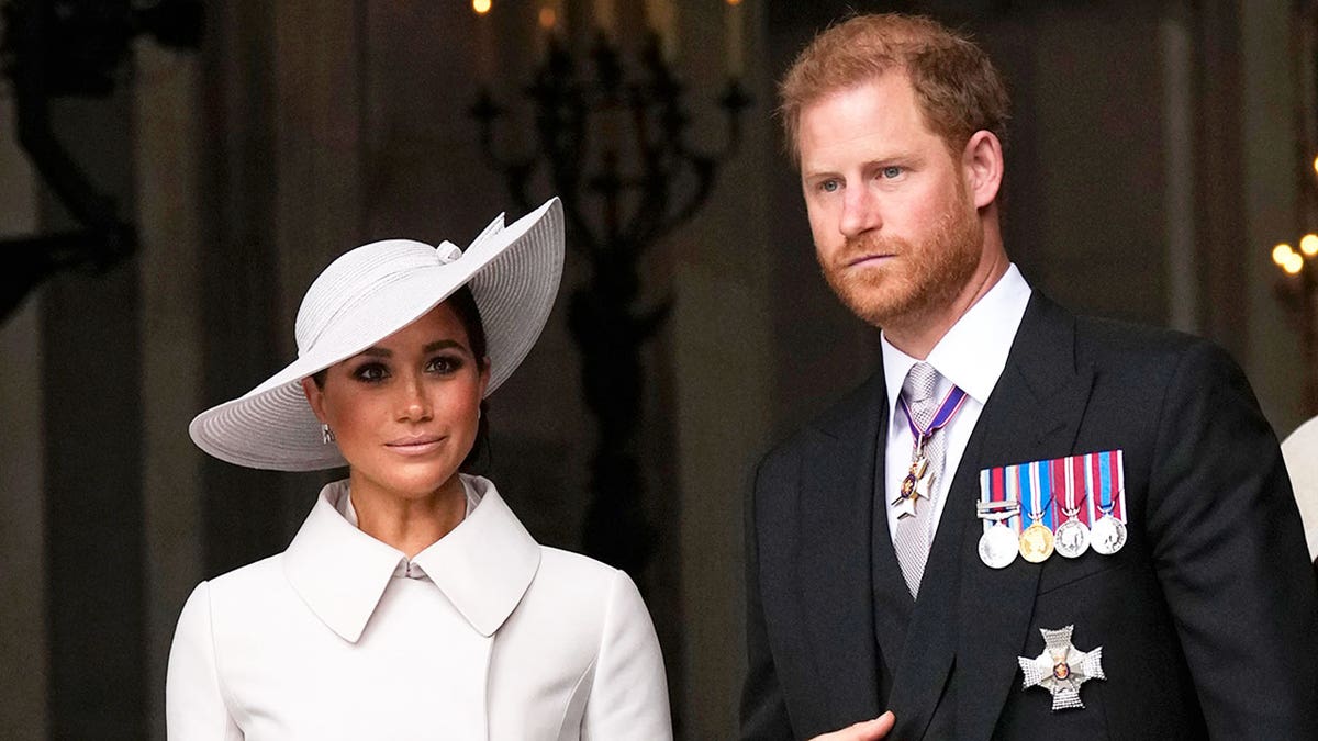 Prince Harry and Meghan Markle walking together in formal wear in the U.K.