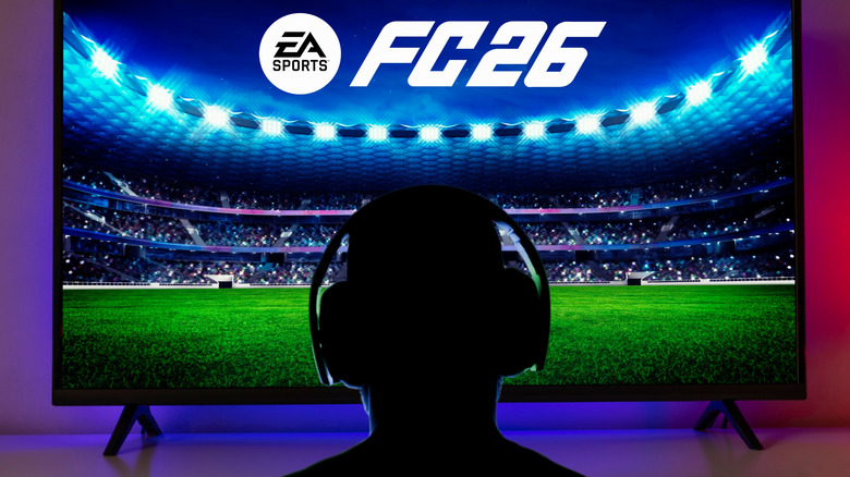 View of a gamer's silhouette with headset against a TV displaying FC 26 by EA Sports