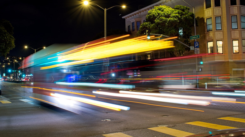 Long exposure photos of a street scene with light trails.