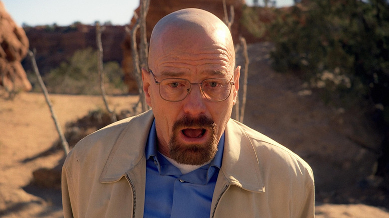 Bryan Cranston as Walter White, appearing shocked in the desert in Breaking Bad.