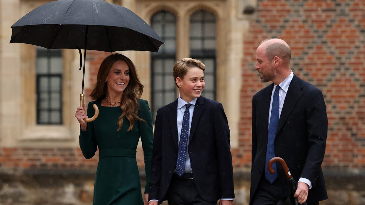 Prince George walks with Catherine, Princess of Wales and Prince William outside Eton College.