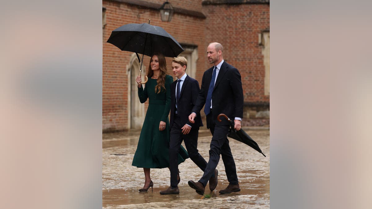 Prince George of Wales walks with Catherine, Princess of Wales and Prince William as he arrives at Eton College.