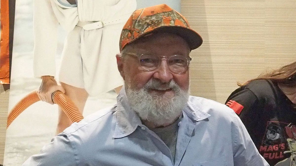 Randy Quaid wears a hat