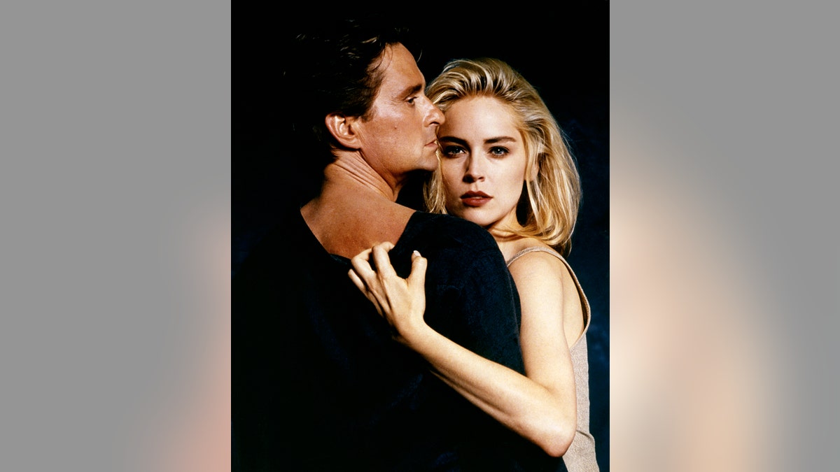 Michael Douglas and Sharon Stone acting out a scene from "Basic Instinct."