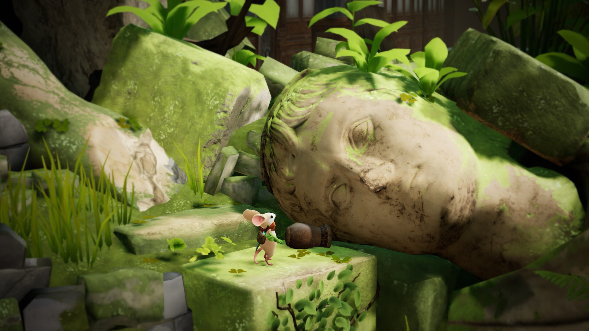 Quill stands on a mossy stone block beside a giant toppled statue head overgrown with moss and green shoots in Moss: The Forgotten Relic