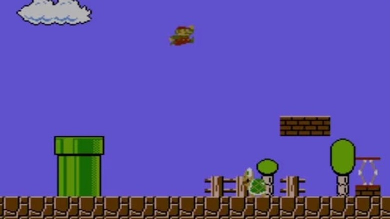 Mario leaps at a Koopa Troopa in Super Mario Bros.